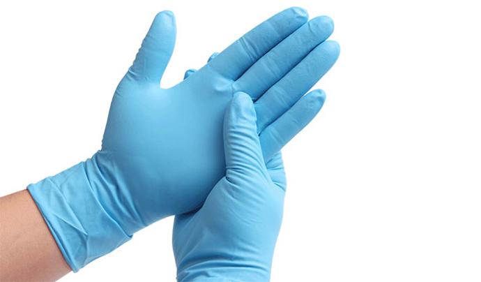 A pair of hands wearing the blue clearview nitrile examination gloves.